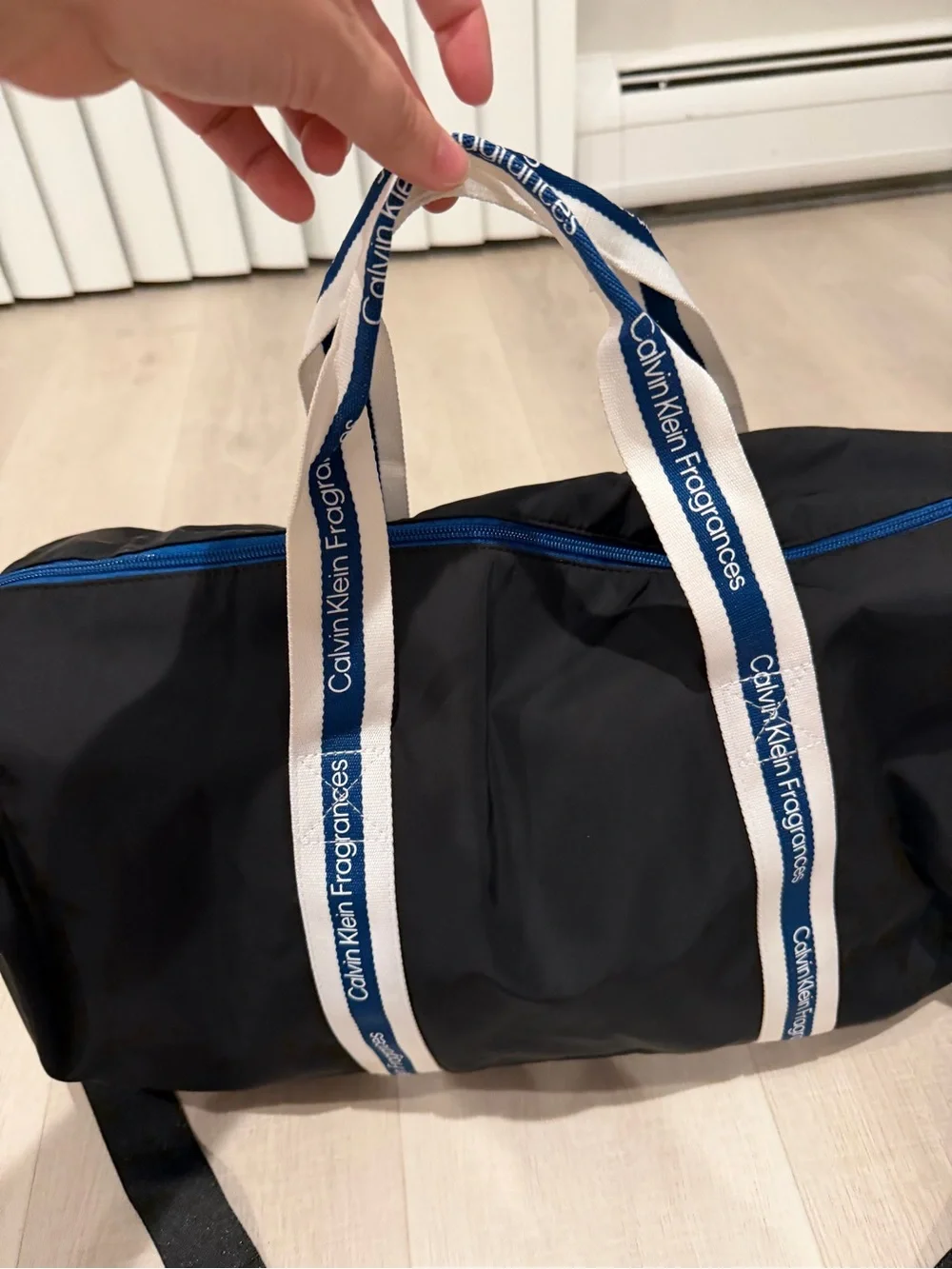 Calvin Klein Black Duffel with White-and-Blue Branded Handles